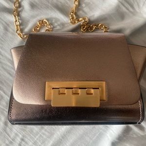 Gorgeous and cute metallic silver mini crossbody.